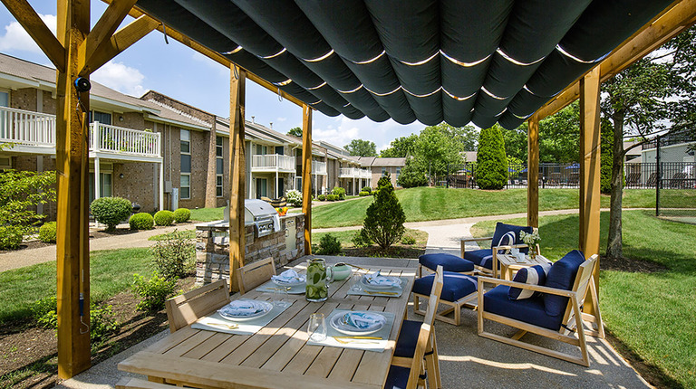 Outdoor chef's kitchen with dining area